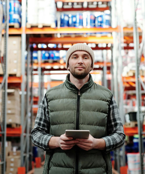 Man In Warehouse Buying Surplus Man In Warehouse Buying Surplus