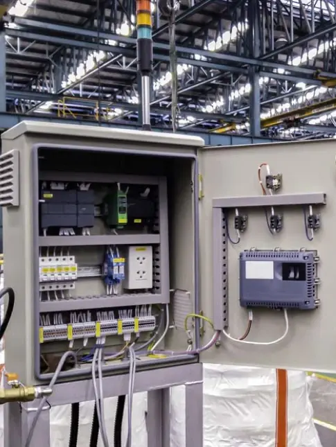 Electrical Control Panel: Industries We Serve An open industrial electrical control panel with wires and components, representing industries we serve.